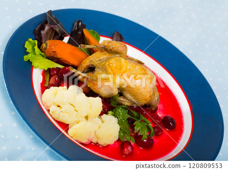 Fried quail with cranberry sauce and caramelized carrots Fried quail with cranberry sauce and caramelized carrots 120809553