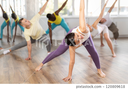 Young Asian woman stretching before training in dance class 120809618