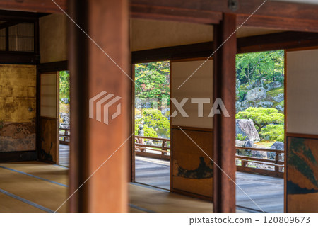 Traditional japanese interior, green zen garden outside 120809673