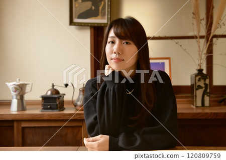 Portrait of a young woman standing 120809759