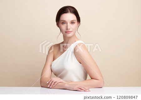 Beautiful young woman with clean fresh skin on beige background, Face care, Facial treatment, Cosmetology, beauty and spa, women portrait. 120809847