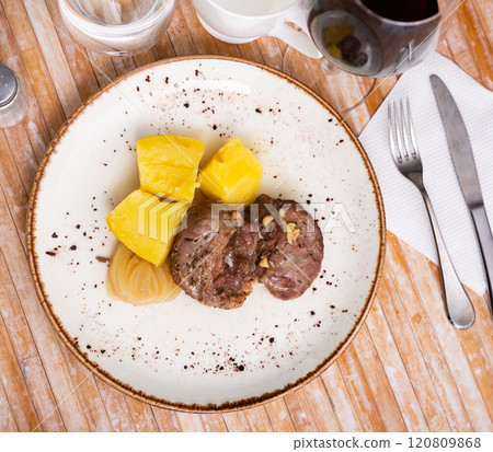 Baked pork pieces with potatoes in goulash Baked pork pieces with potatoes in goulash 120809868