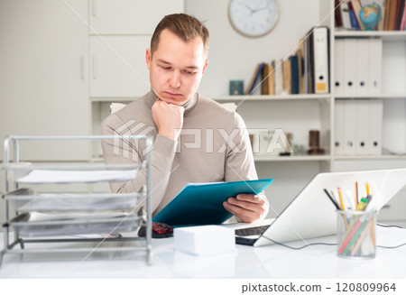 Portrait of thoughtful man office worker Portrait of thoughtful man office worker 120809964