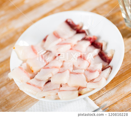Plate of sliced salted salo with layers of meat Plate of sliced salted salo with layers of meat 120810228