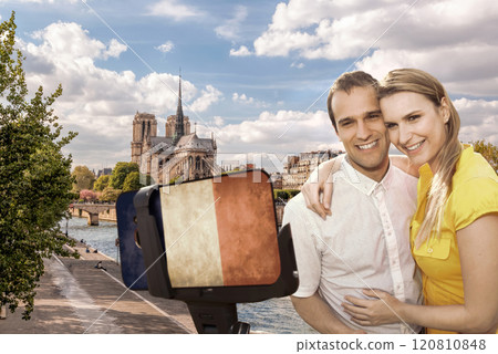Happy couple of tourists taking selfie photo with cellphone covered a French flag in front of Notre Dame in Paris, France Happy couple of tourists taking selfie photo with cellphone covered a French flag in front of Notre Dame in Paris, France 120810848