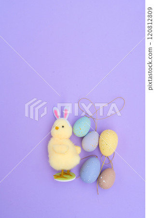 Easter colored eggs in nest 120812809