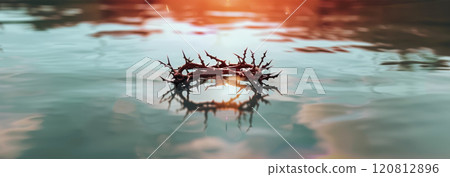 Reflection of the crown of thorns and the crown in serene water, which symbolizes Jesus' suffering and trials 120812896