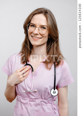 Female Doctor Wearing Pink Scrubs and Glasses Female Doctor Wearing Pink Scrubs and Glasses 120814100