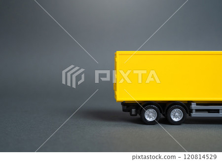 Yellow truck side view. Empty yellow background. Concept of transportation, transport and logistics. Delivery of goods. Freight. 120814529