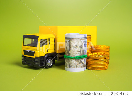 Cargo truck and money with coins. Concept of profitability of transportation and delivery. Transport industry. Logistics and trade. Cargo truck and money with coins. Concept of profitability of transportation and delivery. Transport industry. Logistics and trade. 120814532