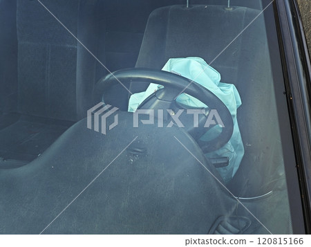 Opened airbag in automobile. Car safety equipment Opened airbag in automobile. Car safety equipment 120815166