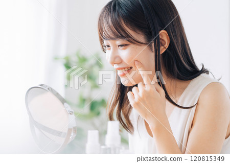A young woman doing skin care A young woman doing skin care 120815349