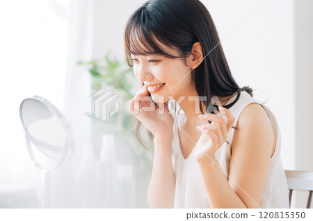 A young woman doing skin care A young woman doing skin care 120815350