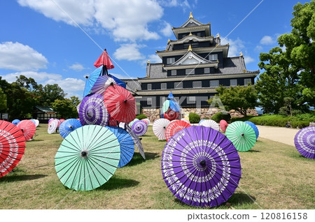 Okayama Castle tower (restored exterior) and Japanese umbrellas 120816158