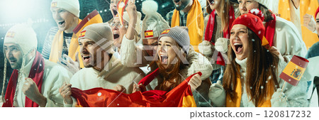 Thrilled Spanish sports fans celebrating with flags and scarves, showing their team pride during game in snow-covered stadium. Thrilled Spanish sports fans celebrating with flags and scarves, showing their team pride during game in snow-covered stadium. 120817232