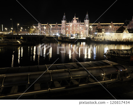 amsterdam central station and channel view at night amsterdam central station and channel view at night 120817434