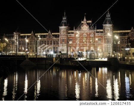 amsterdam central station and channel view at night amsterdam central station and channel view at night 120817435