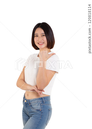 portrait of a Happy Asian woman smiling points her index finger at an empty space in the background and looks straight ahead on white background portrait of a Happy Asian woman smiling points her index finger at an empty space in the background and looks straight ahead on white background 120818114