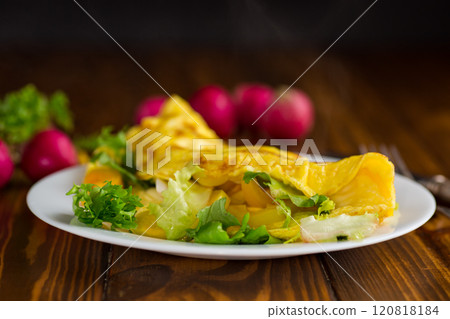 egg roll with sweet pepper and salad, on a wooden table 120818184