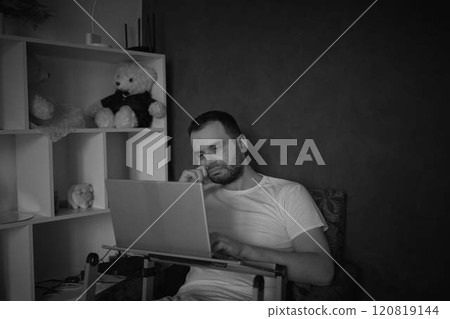 A 30-year-old man is stressed while working on a laptop from his home office A 30-year-old man is stressed while working on a laptop from his home office 120819144