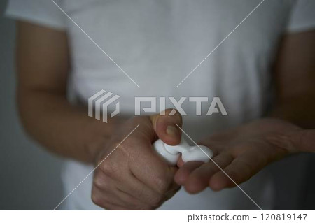 A 30-year-old man applies foam for washing on his skin A 30-year-old man applies foam for washing on his skin 120819147
