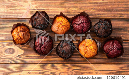 Mix of muffins ( cupcake ) chocolate , vanilla , berries . Top view 120819491