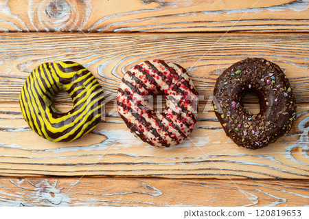 Sweet glazed colorful donuts . Top view Sweet glazed colorful donuts . Top view 120819653