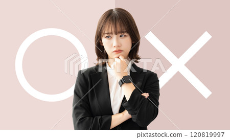 A woman/businesswoman thinking about whether to pass or fail A woman/businesswoman thinking about whether to pass or fail 120819997