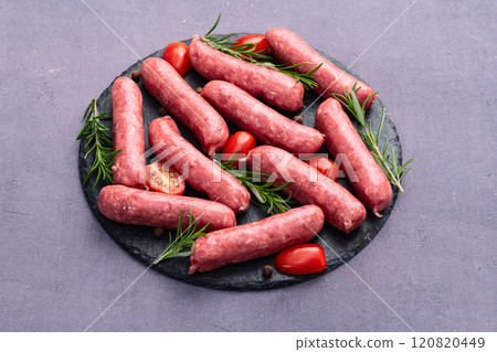 Raw beef sausages with rosemary and tomatoes photography . Top view Raw beef sausages with rosemary and tomatoes photography . Top view 120820449