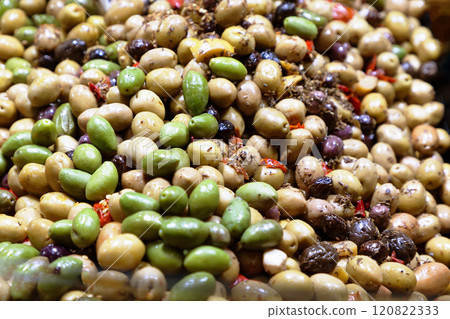 a bunch of different varieties of olives, shiny and marinated in oil a bunch of different varieties of olives, shiny and marinated in oil 120822333