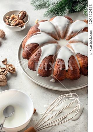 Christmas gingerbread cake glazed on white table with fir branches. Christmas festive dessert, homemade holiday baking recipe Christmas gingerbread cake glazed on white table with fir branches. Christmas festive dessert, homemade holiday baking recipe 120822438