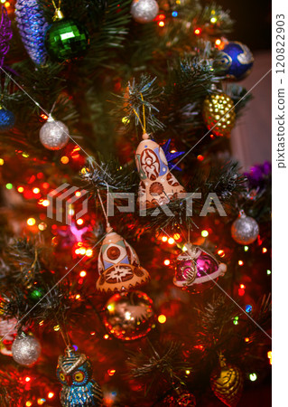 Beautiful festive decorations on the Christmas tree. New Year 2025 120822903