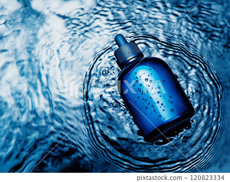 Blue dropper in rippling water 120823334