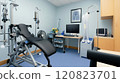 A respiratory therapy room equipped with a pulmonary function test machine, nebulizers, and oxygen therapy equipment. The room features a patient examination chair 120823701