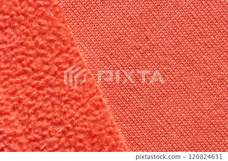 Close up of contrasting textures in bright orange fabric textiles Close up of contrasting textures in bright orange fabric textiles 120824631