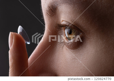 girl wearing soft contact lenses close-up macro, Beauty, vision, ophthalmology girl wearing soft contact lenses close-up macro, Beauty, vision, ophthalmology 120824770