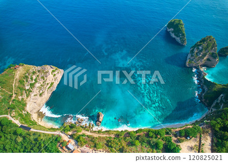 Cinematic aerial landscape shots of the beautiful island Diamond beach of Nusa Penida. Huge cliffs by the shoreline and hidden dream beaches with clear water. Cinematic aerial landscape shots of the beautiful island Diamond beach of Nusa Penida. Huge cliffs by the shoreline and hidden dream beaches with clear water. 120825021