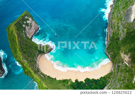 Cinematic aerial landscape shots of the beautiful island dinosaur of Nusa Penida. Huge cliffs by the shoreline and hidden dream beaches with clear water. 120825022
