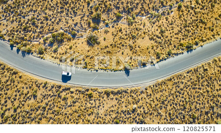 Aerial of Lone Car on Desert Road Red Rock Canyon Adventure Aerial of Lone Car on Desert Road Red Rock Canyon Adventure 120825571