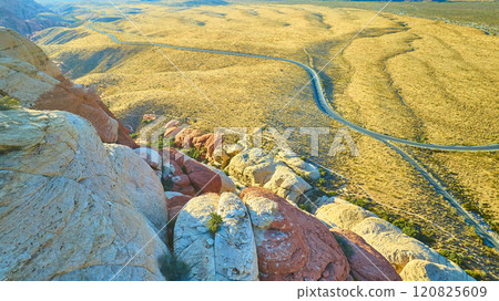 Aerial of Red Rock Canyon Sandstone Formations and Winding Road 120825609