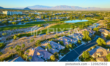 Aerial of Luxurious Suburban Neighborhood and Golf Course at Golden Hour 120825632