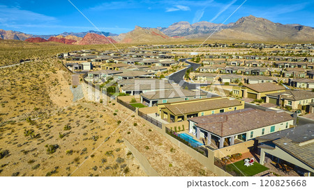 Aerial of Suburban Homes Against Red Rock Canyon Desert Backdrop Aerial of Suburban Homes Against Red Rock Canyon Desert Backdrop 120825668