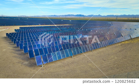 Aerial Desert Solar Farm in Nevada with Distant Mountains Aerial Desert Solar Farm in Nevada with Distant Mountains 120825682