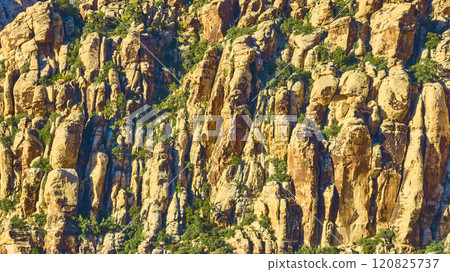 Aerial of Rugged Desert Cliffs in Golden Hour Light 120825737