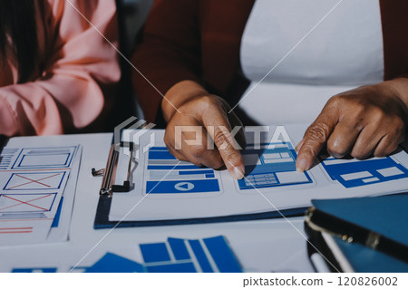 Young Asian business creative team work together, mobile application software design project. Brainstorm meeting, internet technology, smartphone web app designer, office coworker teamwork concept 120826002