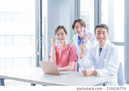 Doctors and nurses doing fist pumps Doctors and nurses doing fist pumps 120826759