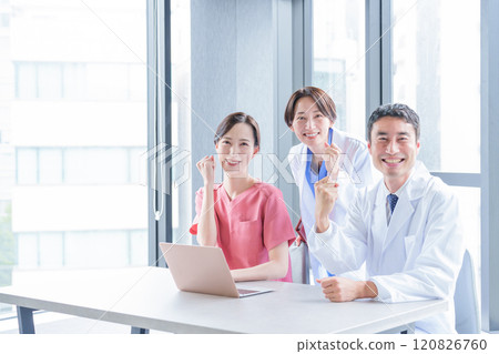 Doctors and nurses doing fist pumps Doctors and nurses doing fist pumps 120826760