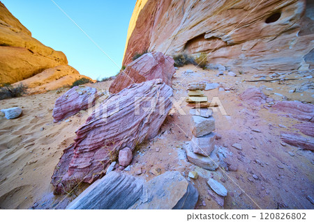 Desert Cairn at Golden Hour with Rock Formations Low Perspective Desert Cairn at Golden Hour with Rock Formations Low Perspective 120826802