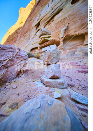 Desert Cairn and Sandstone Cliffs Tranquility Low Angle View 120826864