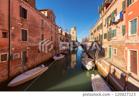 Traditional quiet canal with boats in Venice, Italy Traditional quiet canal with boats in Venice, Italy 120827123